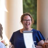 Faculty laughing together outside